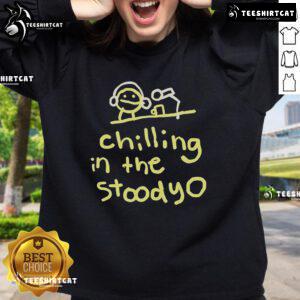 Official Mummy Joe chilling in the studio wearing a stylish sweatshirt, showcasing a relaxed and creative vibe.
