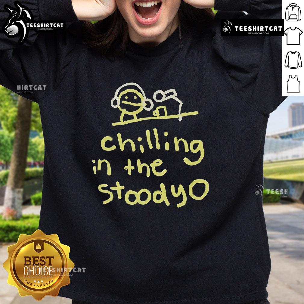 Official Mummy Joe chilling in the studio wearing a stylish sweatshirt, showcasing a relaxed and creative vibe.