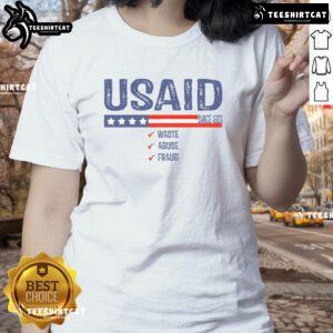 Premium USAID Waste Abuse Fraud Since 1961 Ladies Tee featuring a stylish design and vibrant colors for casual wear.