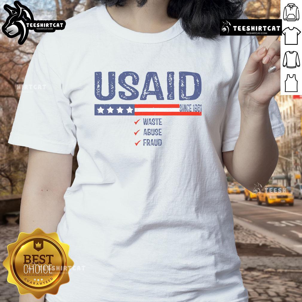Premium USAID Waste Abuse Fraud Since 1961 Ladies Tee featuring a stylish design and vibrant colors for casual wear.