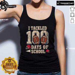 Boy wearing a football tank top celebrating the 100th Day of School in a fun and festive classroom setting.
