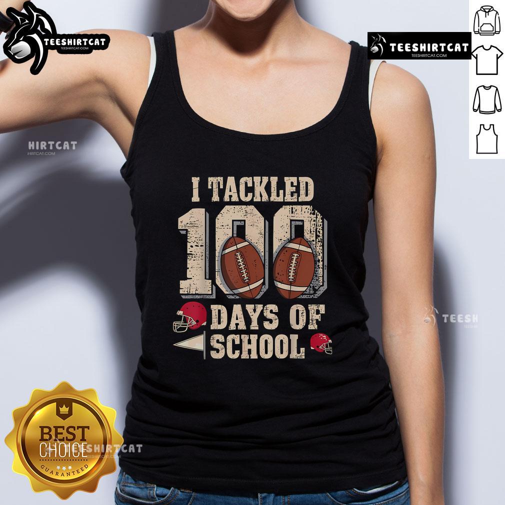Boy wearing a football tank top celebrating the 100th Day of School in a fun and festive classroom setting.