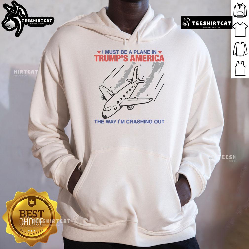 Trendy hoodie with 'Must Be A Plane In Trump's America' slogan, perfect for casual wear and expressing humor.