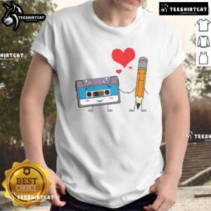 Alt Text: Cute cassette tape pencil graphic on a retro vintage music T-shirt featuring 70's, 80's, and 90's design.
