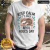 Alt Text: Cute cat graphic on a t-shirt with Keep Calm It's Only April Fools for Cat Fools Day pranks.