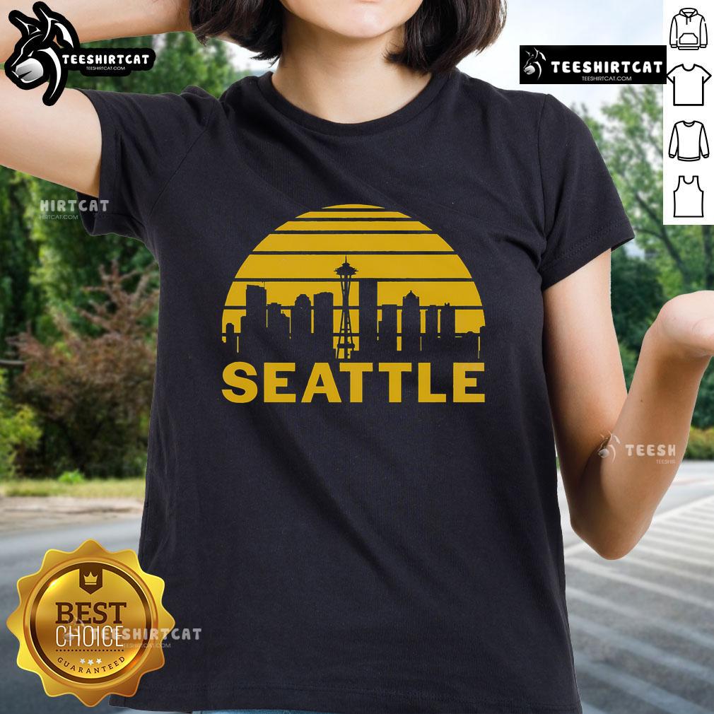 Vintage Seattle cityscape graphic on ladies tee, showcasing iconic skyline and urban charm of Washington.