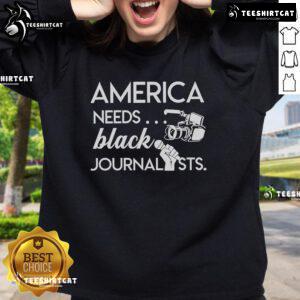 Roland S. Martin wearing a sweatshirt with Hot America Needs Black Journalists graphic, promoting diversity in media.