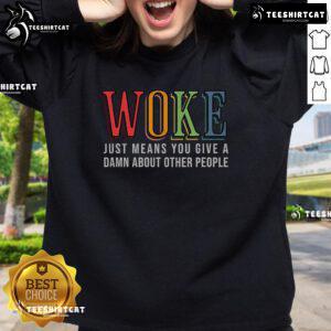 Hot Woke sweatshirt featuring the phrase 'Just Means You Give A Damn About Other People' in bold, vibrant lettering.
