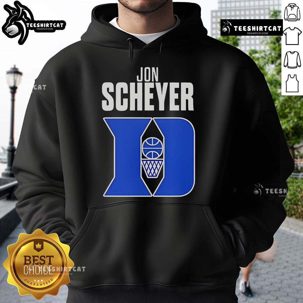 Alt Text: Jon Scheyer, Duke Blue Devils basketball coach, wearing a hoodie, celebrates Coach of the Year award victory.