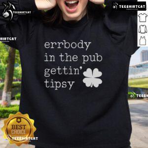 Group of friends in a pub wearing 'Nice Errbody In The Pub Getting Tipsy' St. Patrick's Day sweatshirt, celebrating together.