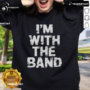 Person wearing a 'Nice, I'm With The Band' sweatshirt at a lively concert, enjoying the music and atmosphere.