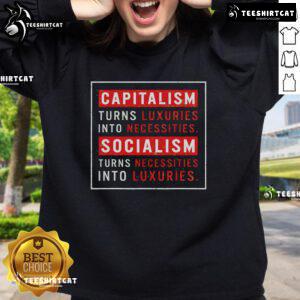 Alt Text: Official sweatshirt featuring the phrase 'Capitalism Turns Luxuries Into Necessities, Socialism Turns Necessities Into Luxuries.'