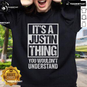 Cozy Official 'It's A Justin Thing You Wouldn't Understand' sweatshirt displayed on a hanger, perfect for fans.