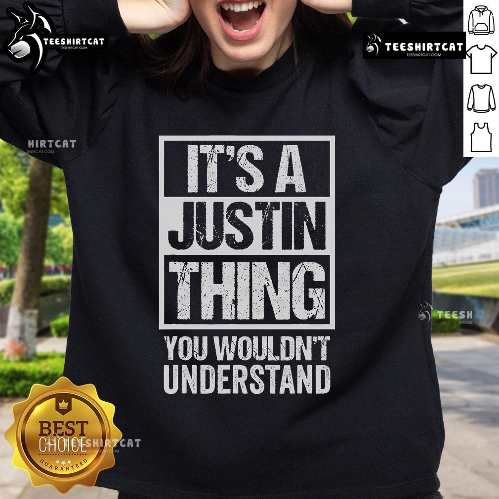 Cozy Official 'It's A Justin Thing You Wouldn't Understand' sweatshirt displayed on a hanger, perfect for fans.