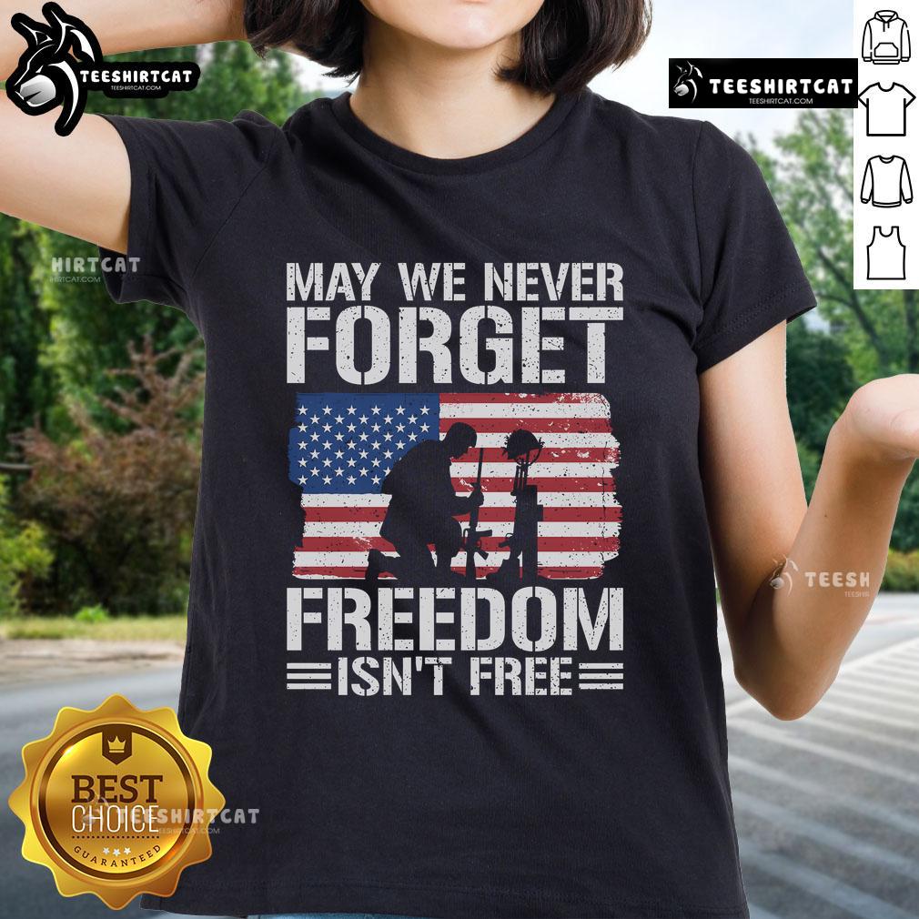 Official 'May We Never Forget - Freedom Isn't Free' Ladies Tee featuring patriotic design and comfortable fit.