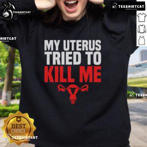 Alt Text: Official My Uterus Tried To Kill Me sweatshirt for post-hysterectomy recovery humor, featuring a playful design.