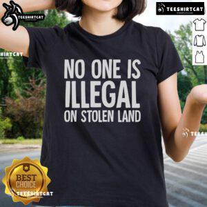 Official Native American Indigenous 'No One Is Illegal On Stolen Land' Ladies Tee, featuring bold text and a vibrant design.