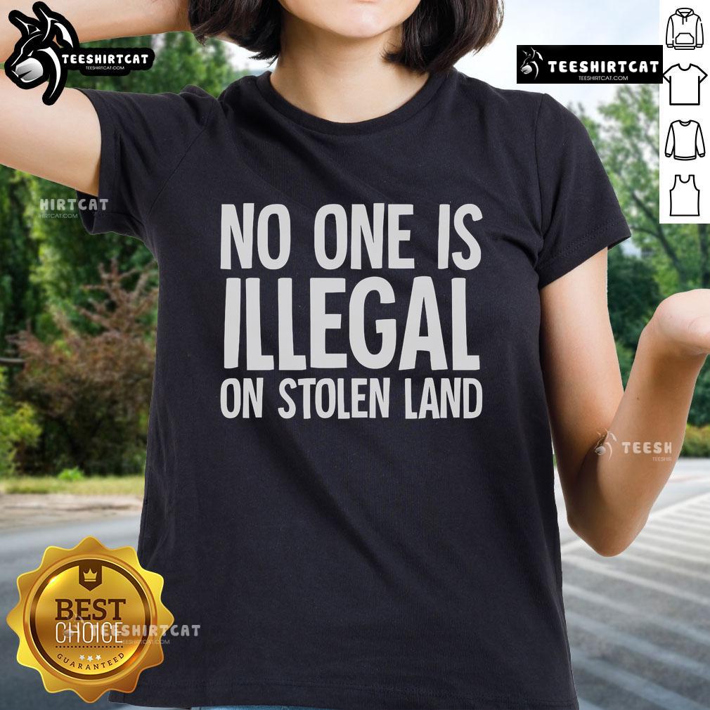 Official Native American Indigenous 'No One Is Illegal On Stolen Land' Ladies Tee, featuring bold text and a vibrant design.