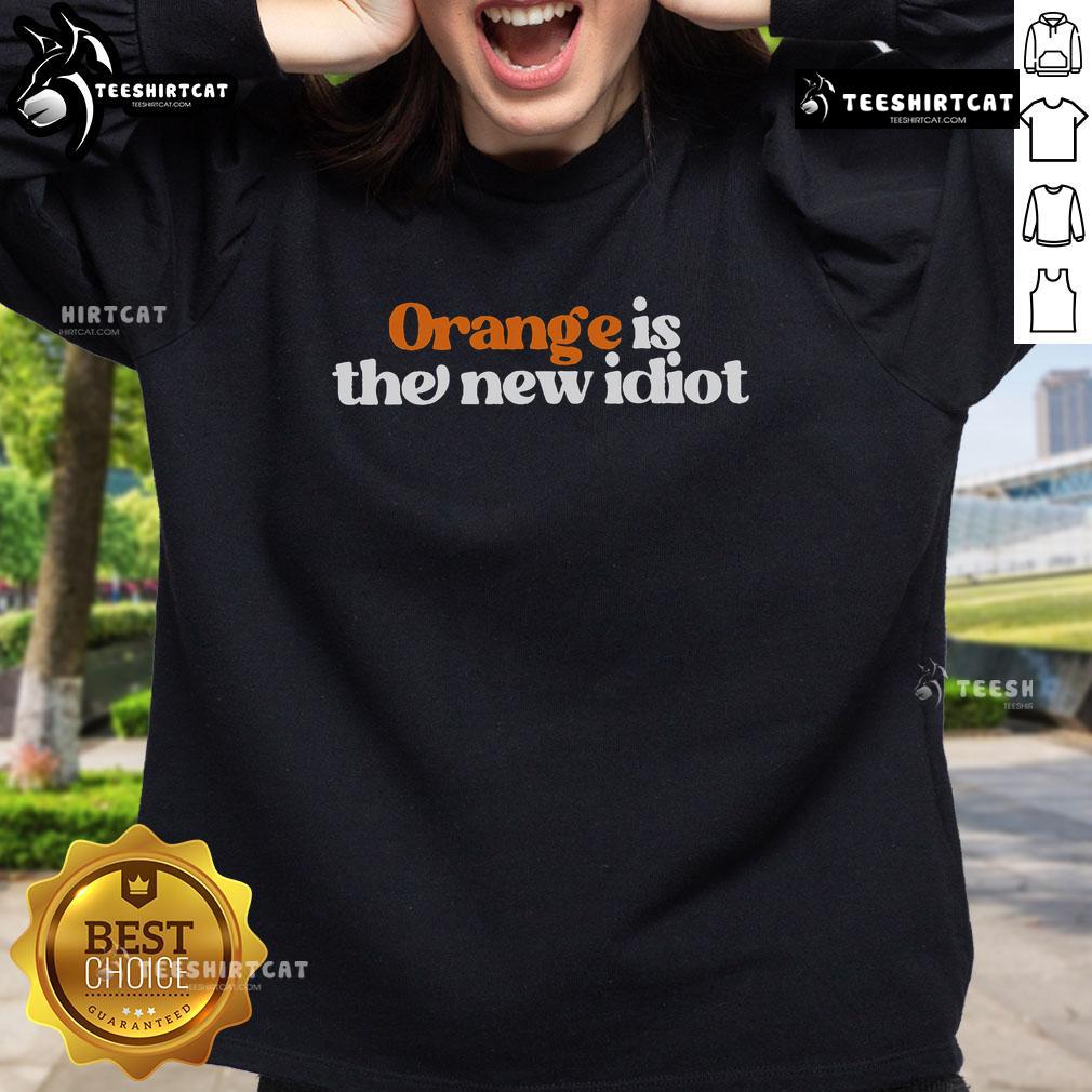 Alt Text: Official Orange Is The New Idiot Sweatshirt featuring bold graphic design, perfect for casual wear and statement pieces.