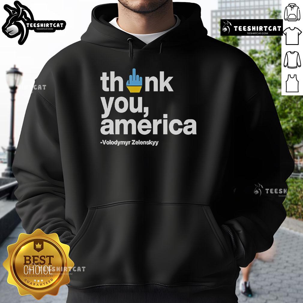 Volodymyr Zelensky wearing a 'Thank You America' hoodie, showcasing support and gratitude towards the U.S.