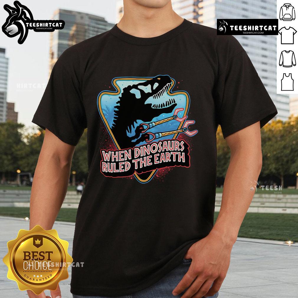 Official When Dinosaurs Ruled The Earth T-Shirt featuring vibrant dinosaur graphics and classic movie-inspired design.