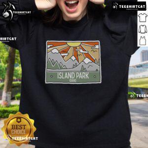 Scenic view of Pretty Island Park in Idaho with mountains and sunshine, perfect for an Idaho trip sweatshirt design.