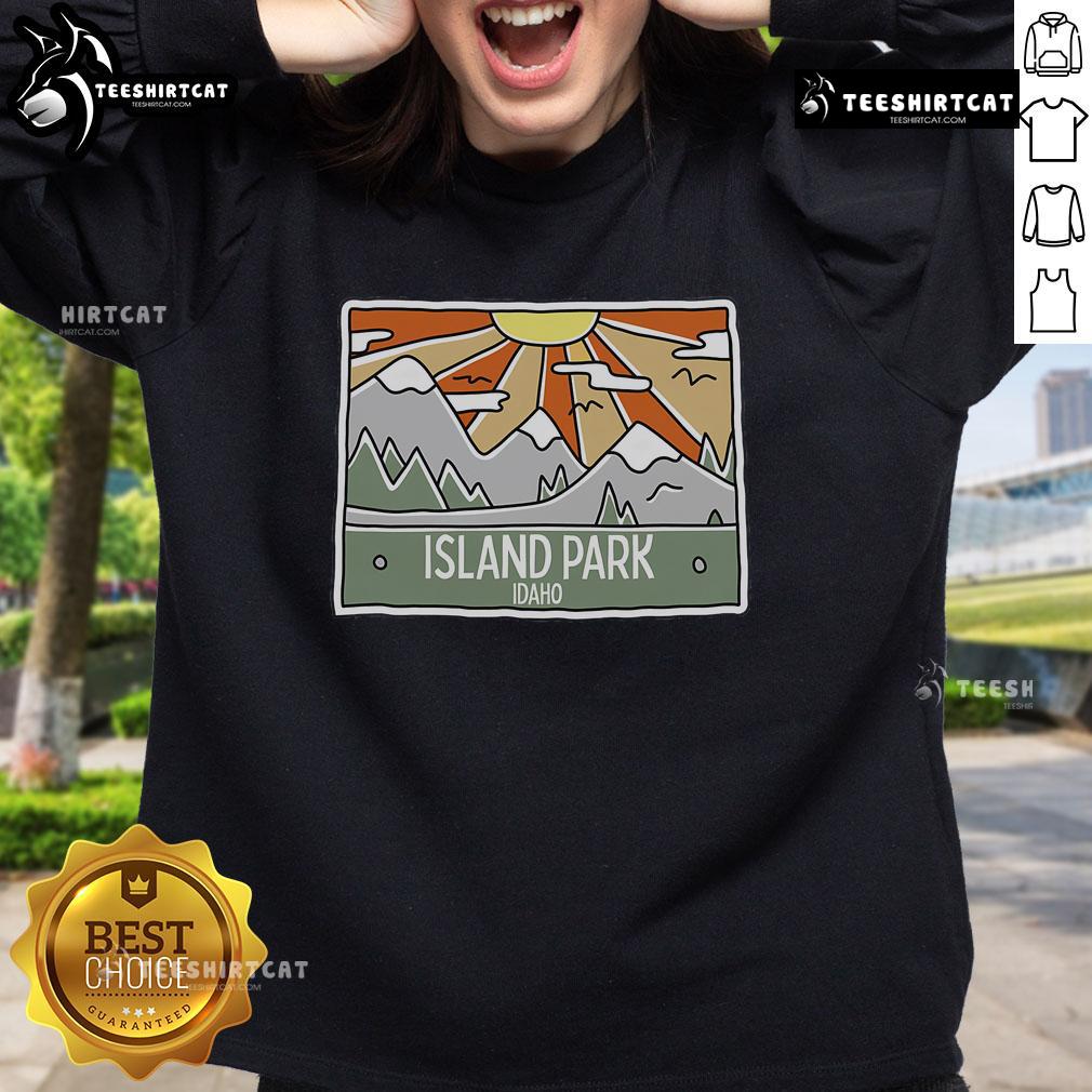 Scenic view of Pretty Island Park in Idaho with mountains and sunshine, perfect for an Idaho trip sweatshirt design.