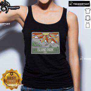 Sunny view of Pretty Island Park in Idaho with mountains, perfect for an outdoor adventure in a tank top.