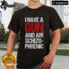 Top I Have A Gun And Am Schizophrenic T-Shirt featuring bold graphic text on a stylish casual tee.