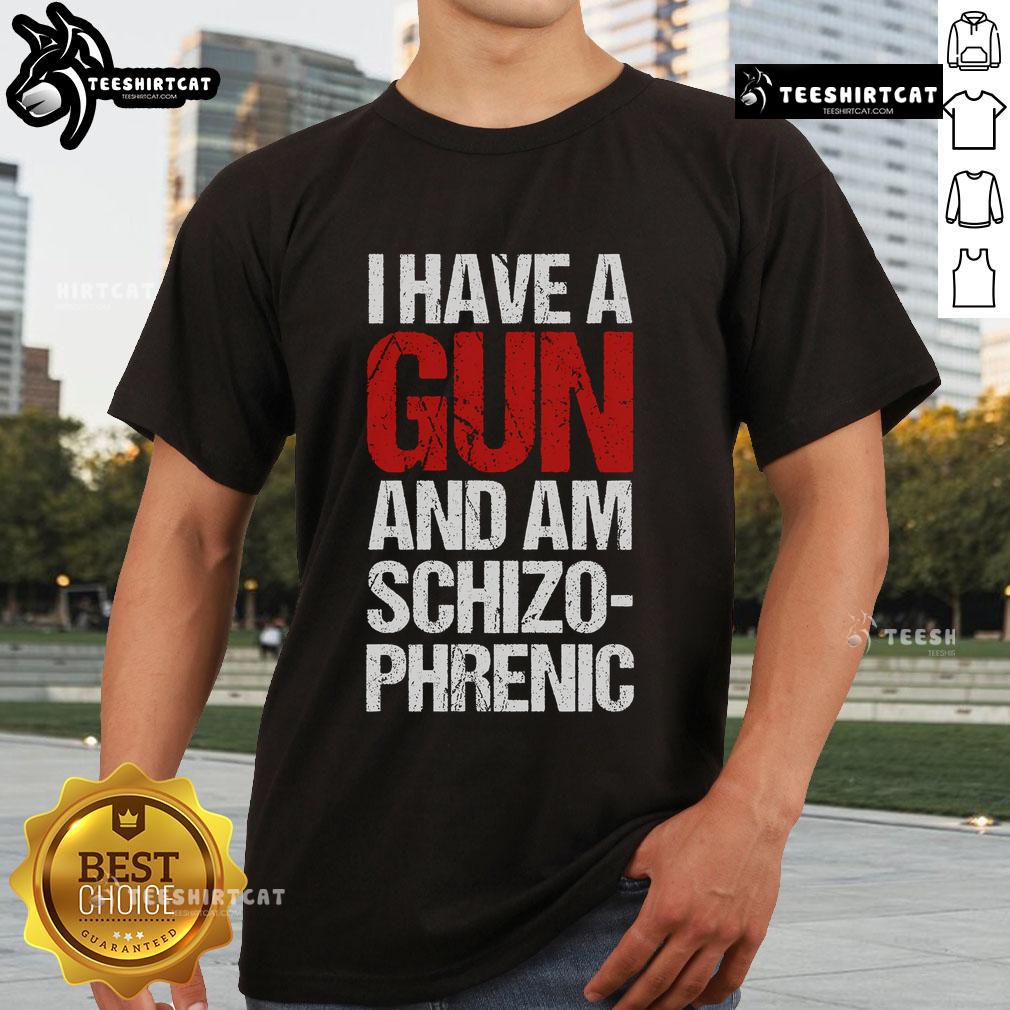 Top I Have A Gun And Am Schizophrenic T-Shirt featuring bold graphic text on a stylish casual tee.