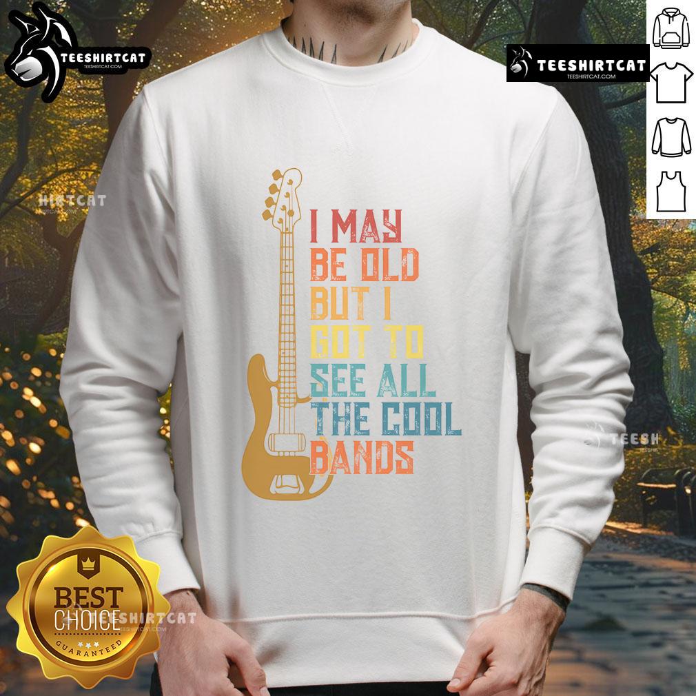 Cute I May Be Old But I Got To See All The Cool Bands sweatshirt displayed on a hanger, showcasing its vibrant design.