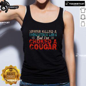 Funny Never Killed A Mountain Lion But I've Choked A Cougar Tank Top featuring a humorous graphic design and bold text.