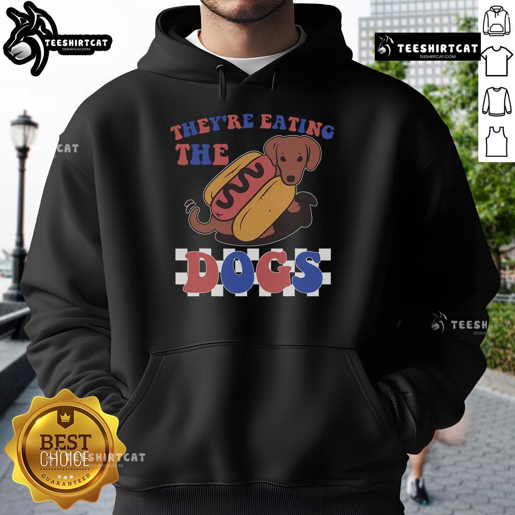 Funny Independence Day hoodie featuring dogs humorously eating hot dogs, perfect for July 4th celebrations.