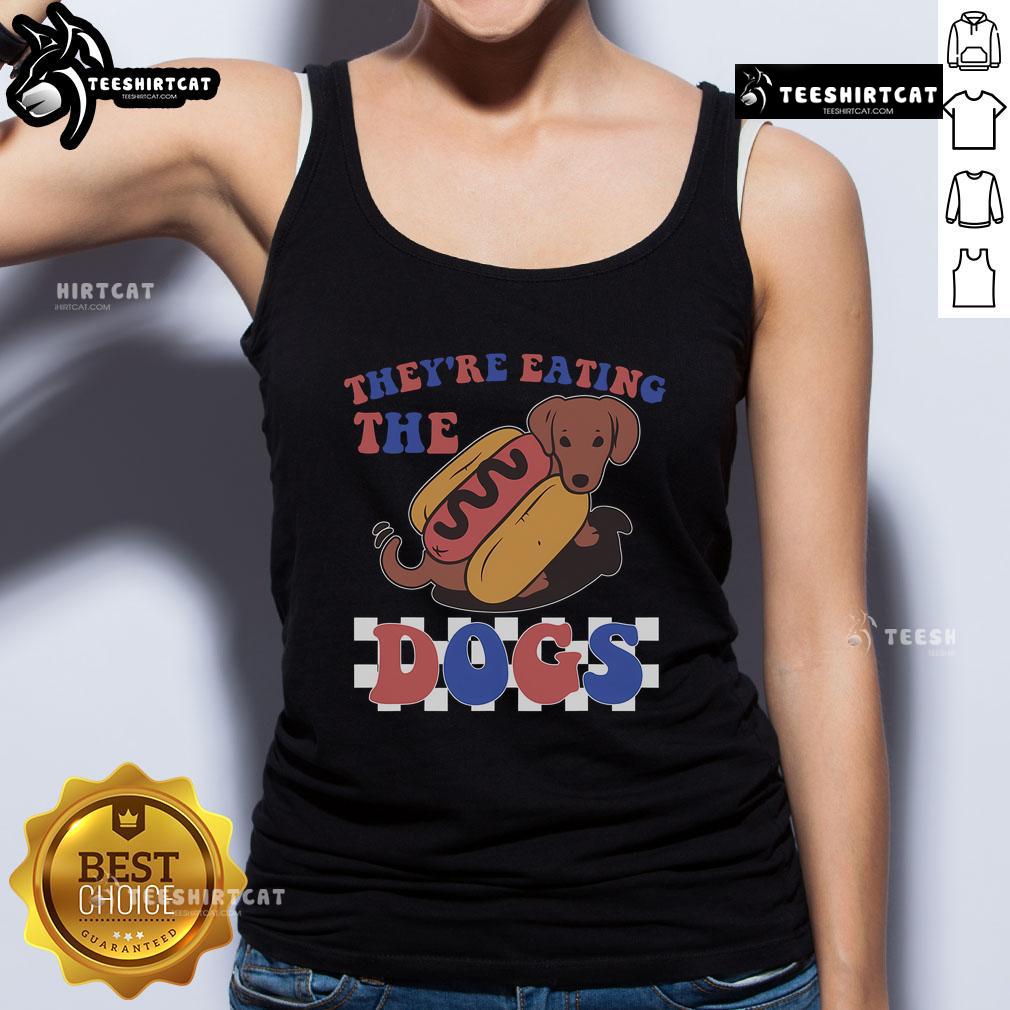 Funny 'Theyre Eating the Dogs' Independence Day tank top featuring a humorous graphic for festive celebrations.
