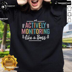 Teacher wearing 'Nice Actively Monitoring Like A Boss' sweatshirt during state testing day, showcasing a motivating vibe.