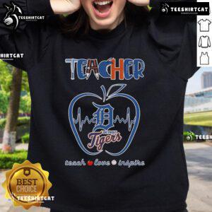 Detroit Tigers teacher sweatshirt with 'Teach, Love, Inspire' design and apple graphic, perfect for educators and fans.