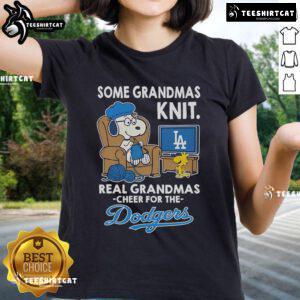 Womens tee featuring Snoopy and Woodstock cheering for the Los Angeles Dodgers, perfect for grandmas and fans alike.