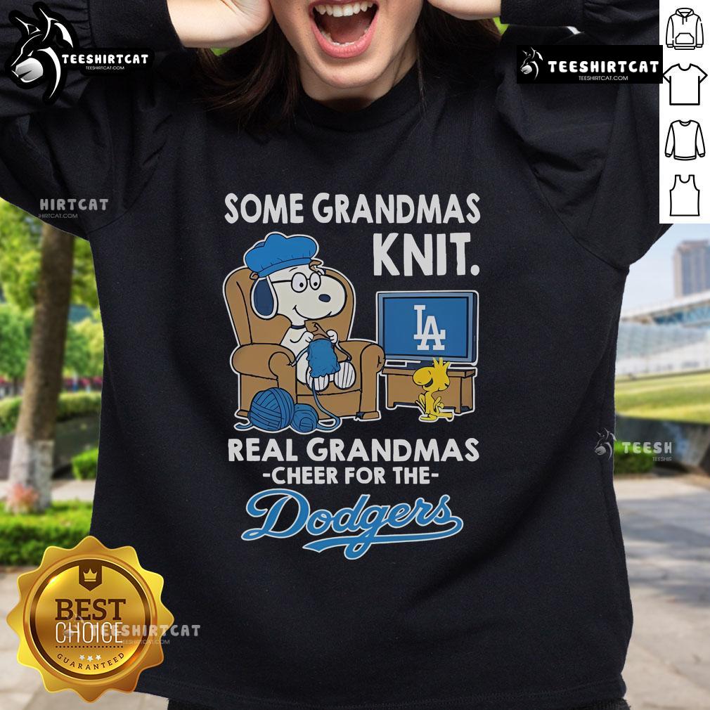 Cozy sweatshirt featuring Snoopy and Woodstock cheering for the Los Angeles Dodgers, perfect for grandmas and baseball fans.