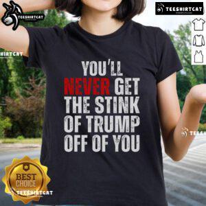 Funny 'You'll Never Get The Stink Of Trump Off Of You' ladies tee showcasing a humorous political design.