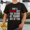 Alt Text: Funny Trumpsmells T-Shirt featuring 'Nice You'll Never Get The Stink Of Trump Off Of You' slogan, perfect for political satire.