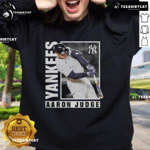 Alt Text: Official Aaron Judge New York Yankees MLB baseball player wearing a stylish sweatshirt during a hot streak.