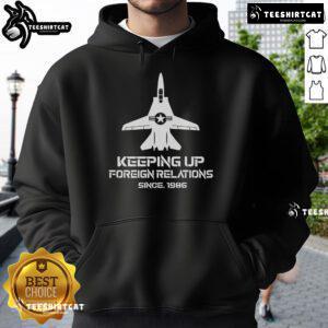 Alt Text: Official Keeping Up Foreign Relations Since 1986 Hoodie featuring bold text on a stylish black background.