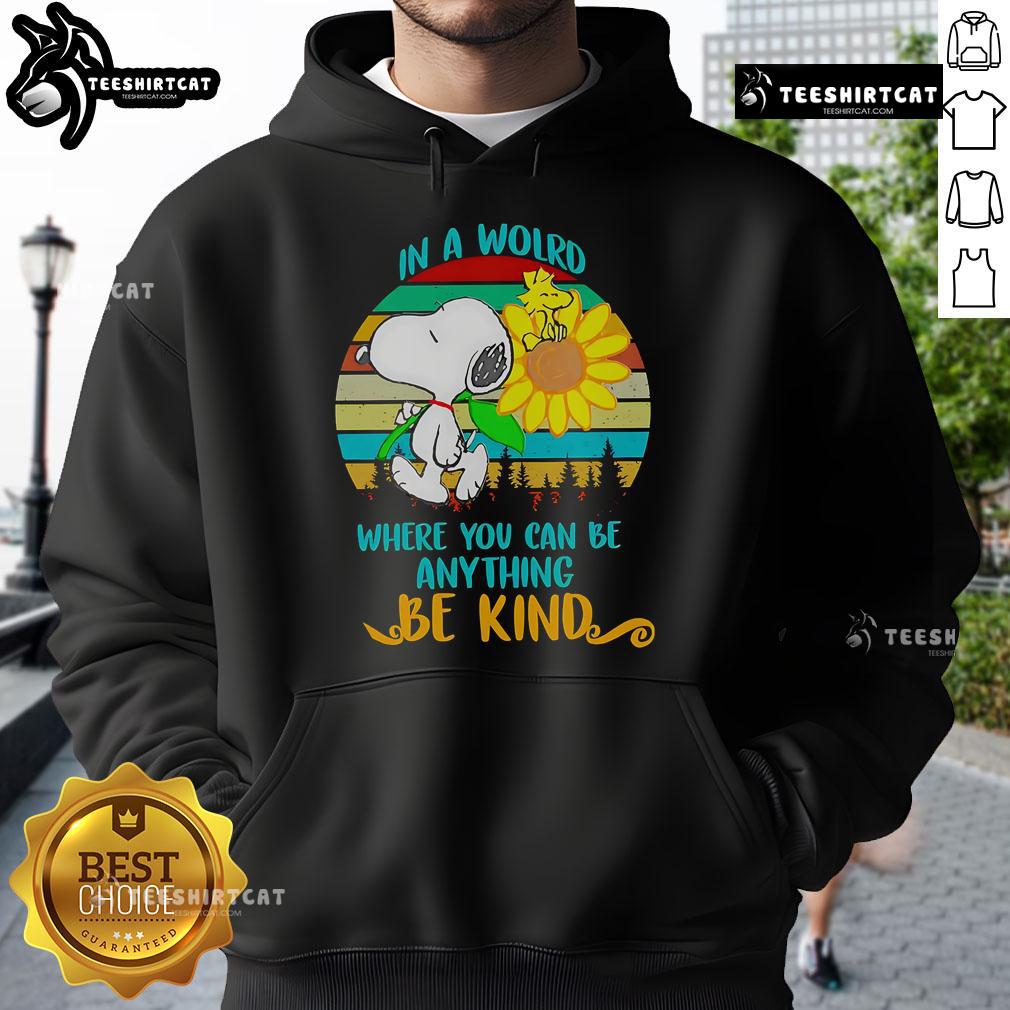 Happy Snoopy in a sunflower design on a retro hoodie with the quote 'In a world where you can be anything, be kind.'
