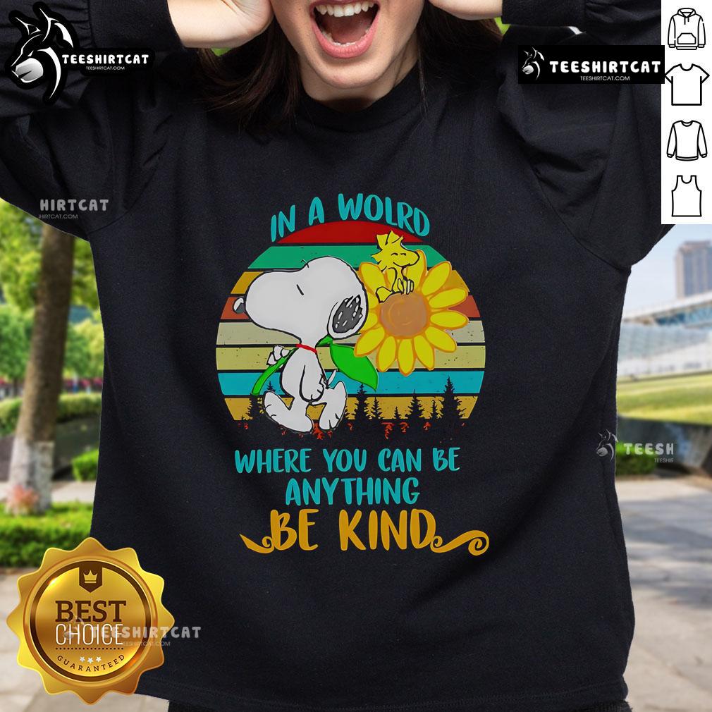 Happy Snoopy with sunflowers on a retro sweatshirt featuring 'Be Kind' quote, perfect for casual wear and dog lovers.
