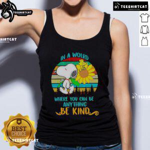 Alt Text: Happy Snoopy with sunflowers on a retro tank top, featuring the quote In a world where you can be anything, be kind.
