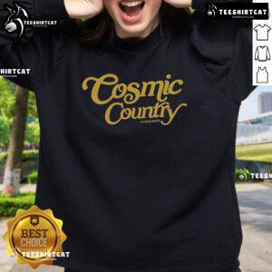 Kaitlin Butts wearing a stylish Cosmic Country sweatshirt, showcasing a trendy design perfect for country music fans.