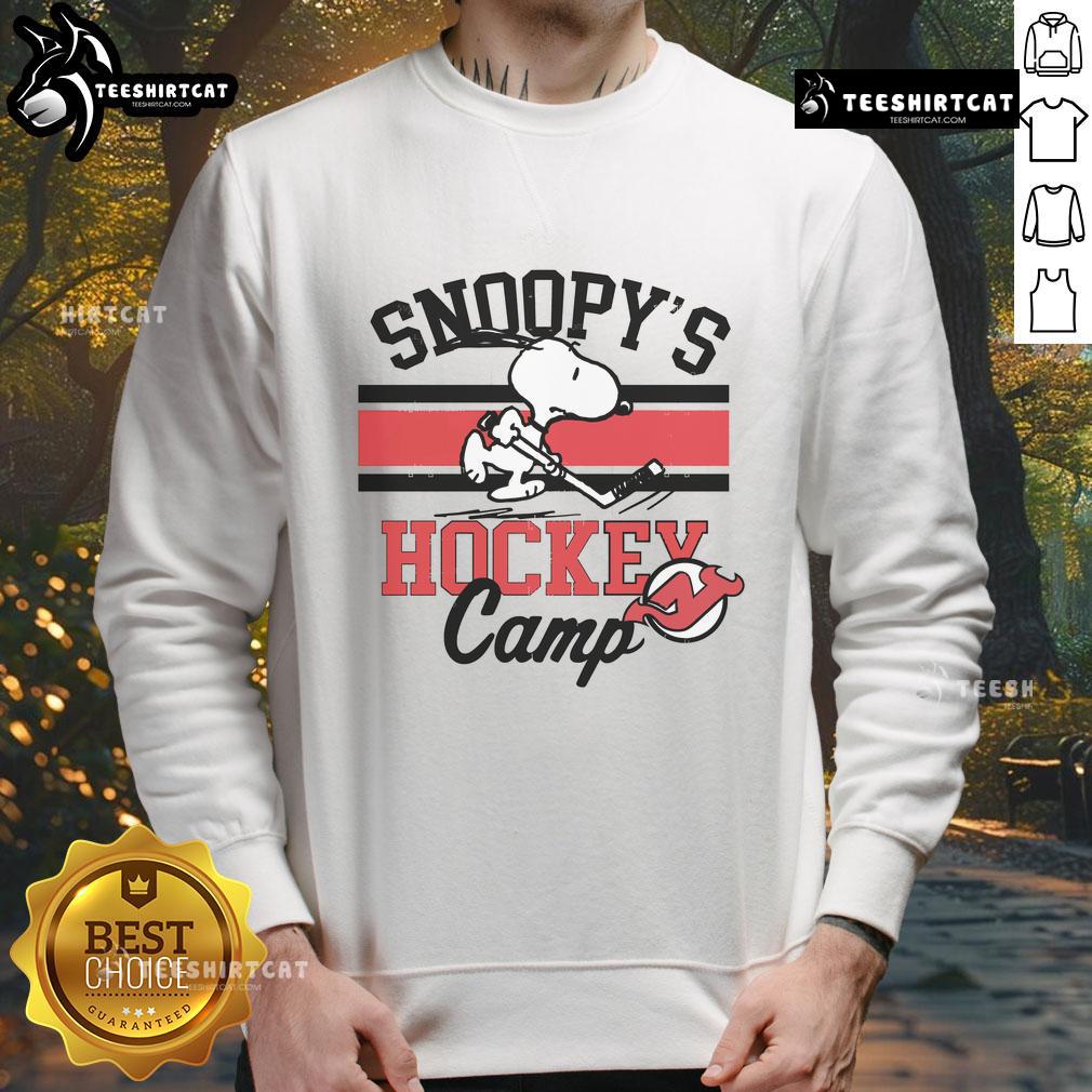 Snoopy wearing a New Jersey Devils sweatshirt at Snoopy's Hockey Camp, celebrating NHL teams in a fun design.