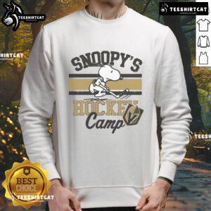 Snoopy in a Vegas Golden Knights sweatshirt at Snoopy's Hockey Camp, celebrating NHL teams and hockey spirit.