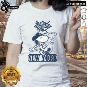 Alt Text: Official Bronx Bombers Snoopy New York Yankees baseball ladies tee featuring fun Snoopy graphic design.