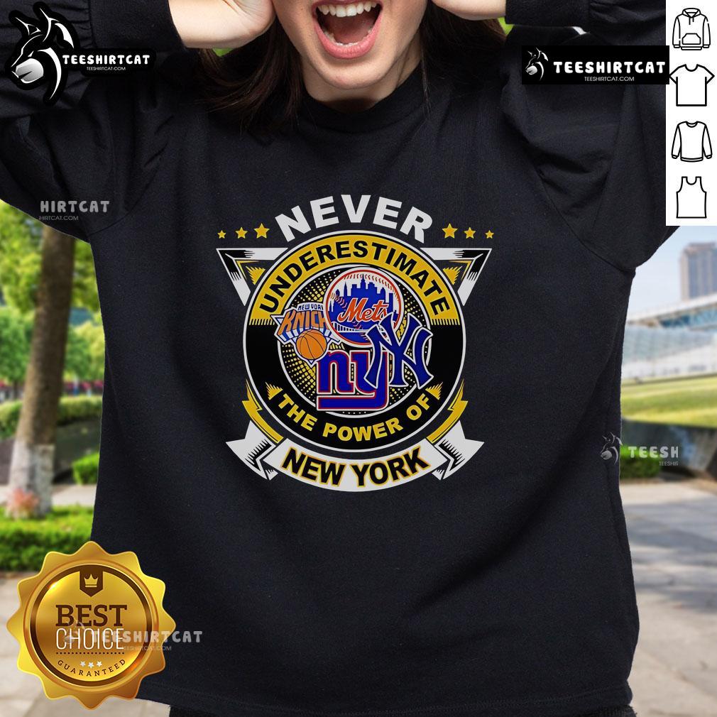 Alt Text: Official Never Underestimate The Power Of New York Sports Sweatshirt in navy blue with bold graphic design.